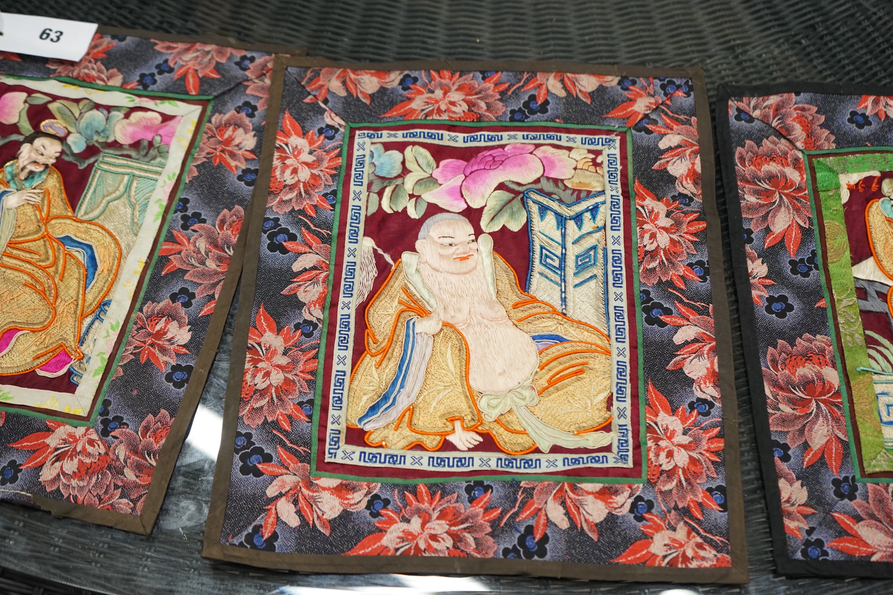 Three Chinese embroidered robe panels, each width 26cm, height 32cm